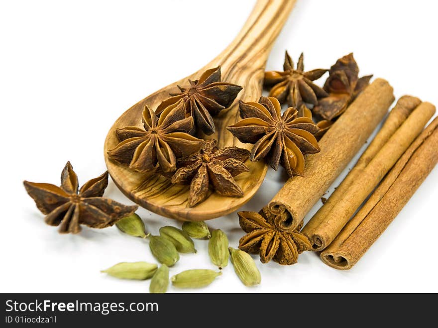 Cinnamon Sticks,Cardamom,vanilla bean and star anise on white - tight depth of field