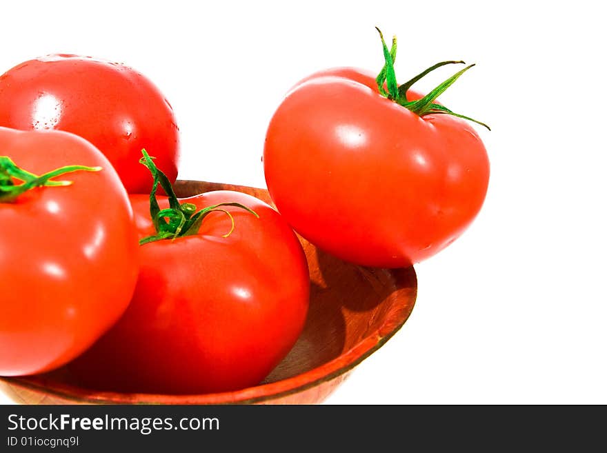 Several red and big tomato in bowl. isolated. Several red and big tomato in bowl. isolated.