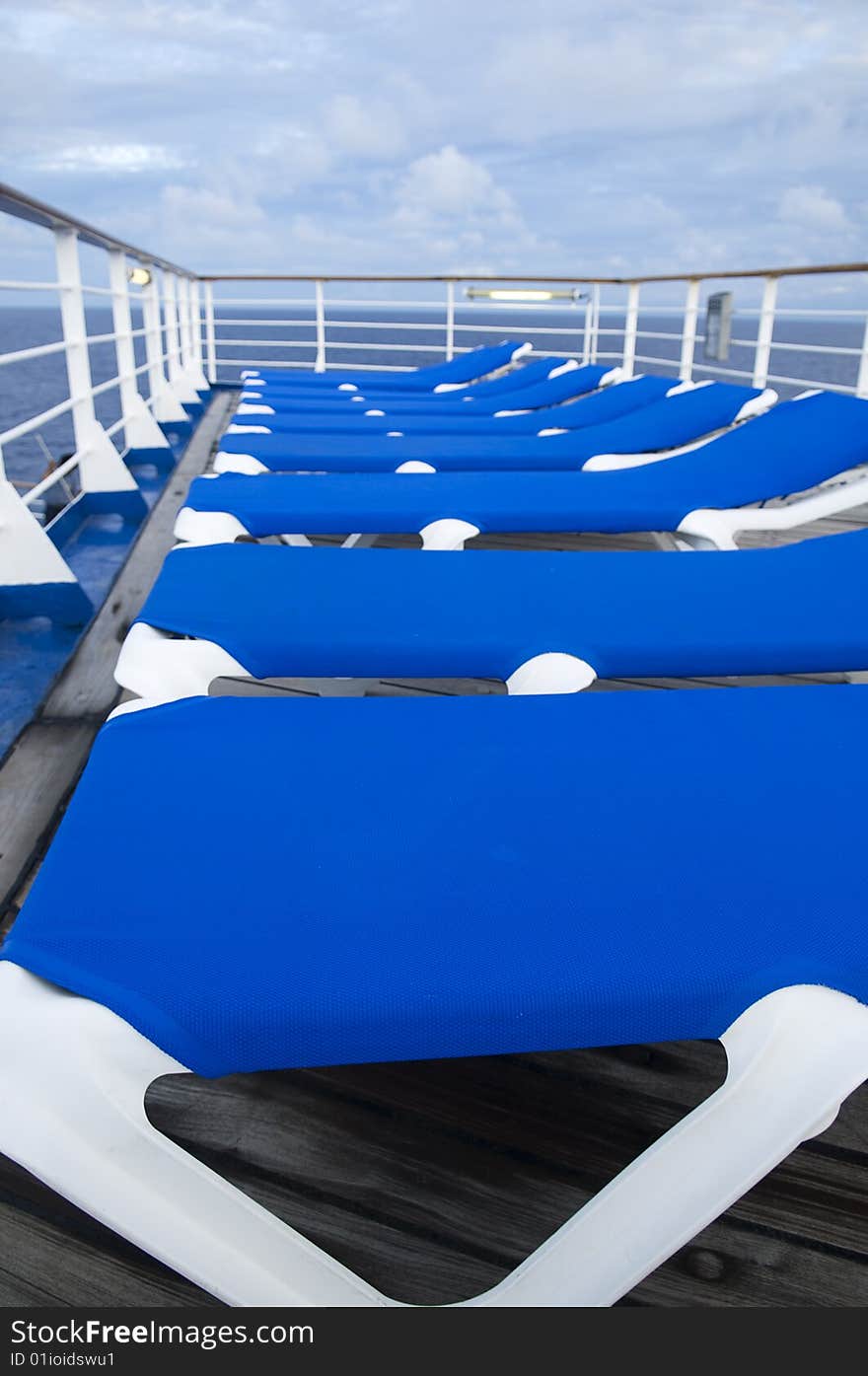 South pacific cruise....looking out onto blue deck chairs. South pacific cruise....looking out onto blue deck chairs