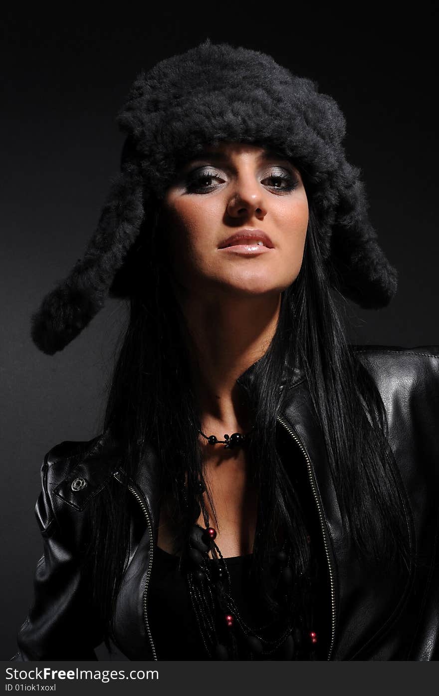 Woman in a fancy russian hat over black