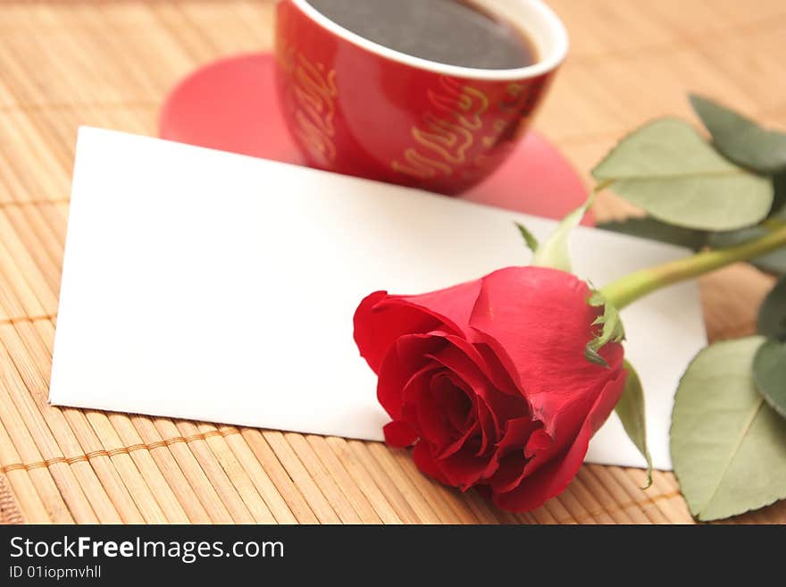 Still-life with a cup of coffee, a rose and the letter. Still-life with a cup of coffee, a rose and the letter