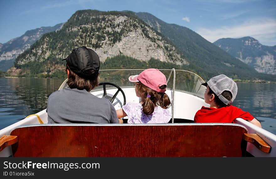 Mother With 2 Kids In A Boat