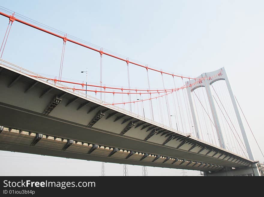 The large modern cable stayed bridge with steel bottom over a river in Guangdong. The large modern cable stayed bridge with steel bottom over a river in Guangdong.