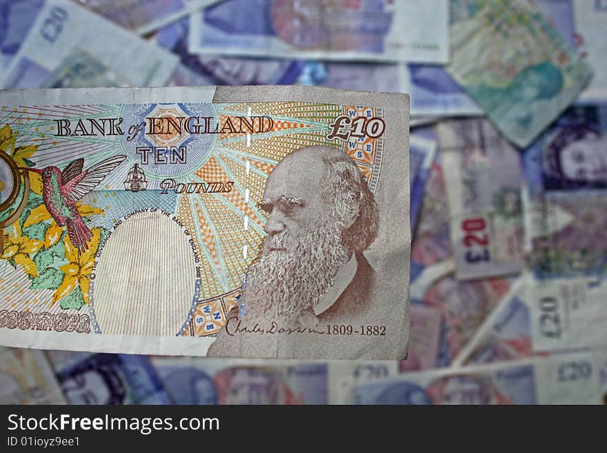 Ten pound note over background of other notes