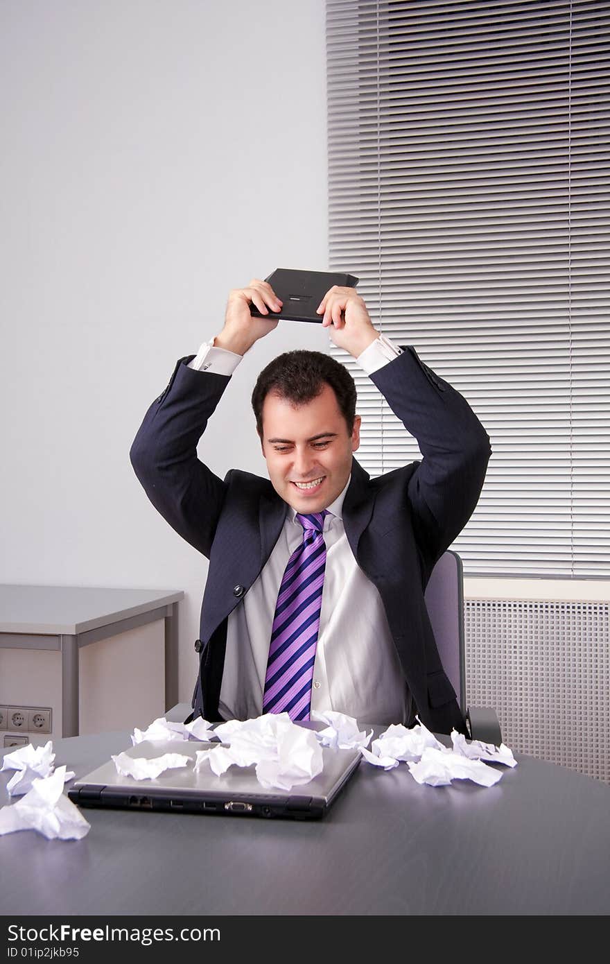 Businessman breaking off calculator