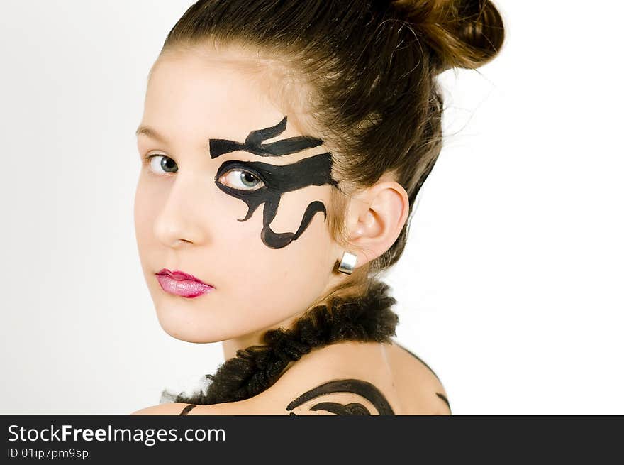 Closeup of girl with black scorpio sign painted on back and face. Closeup of girl with black scorpio sign painted on back and face