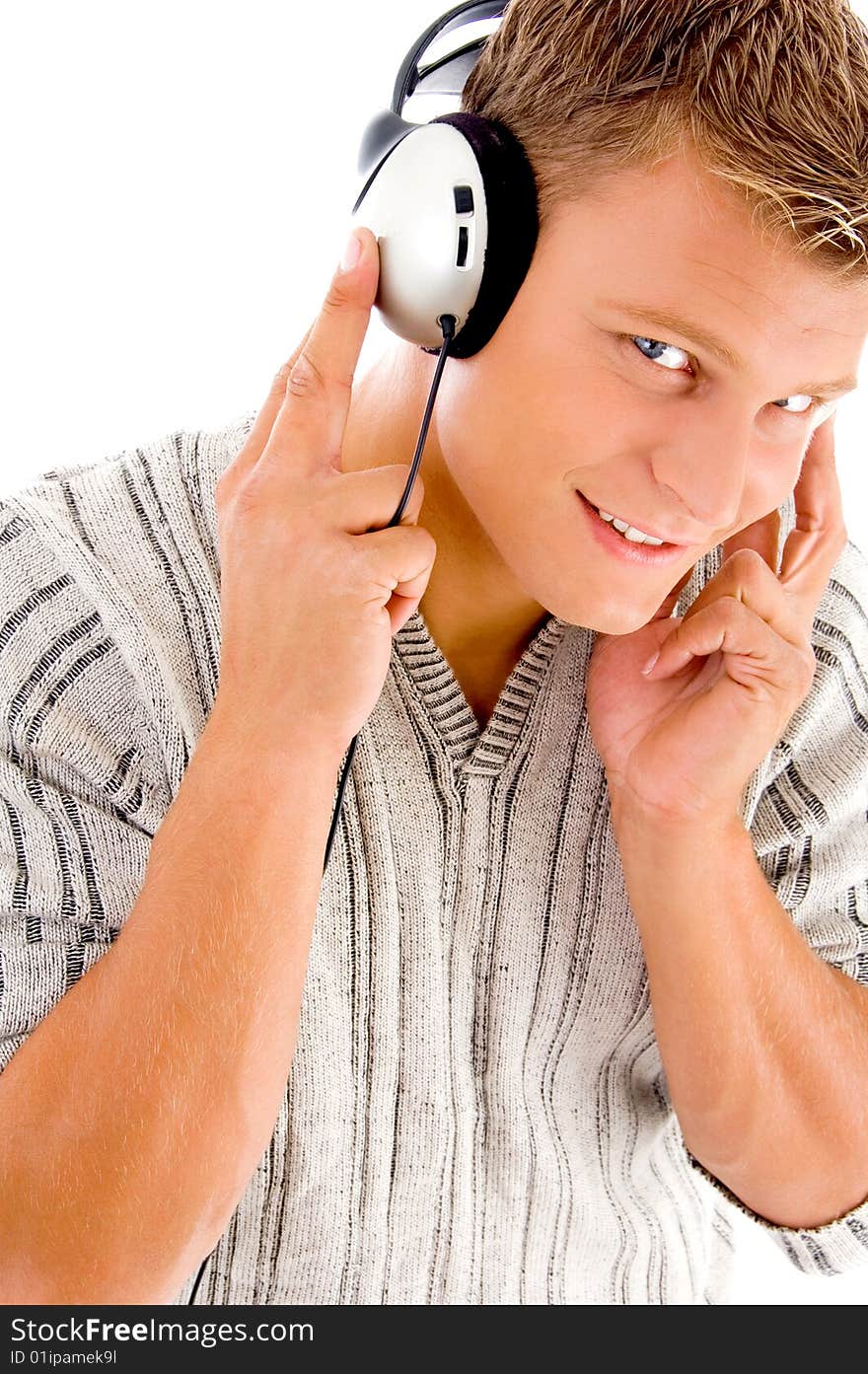 Man listening to music on headphone on an isolated background