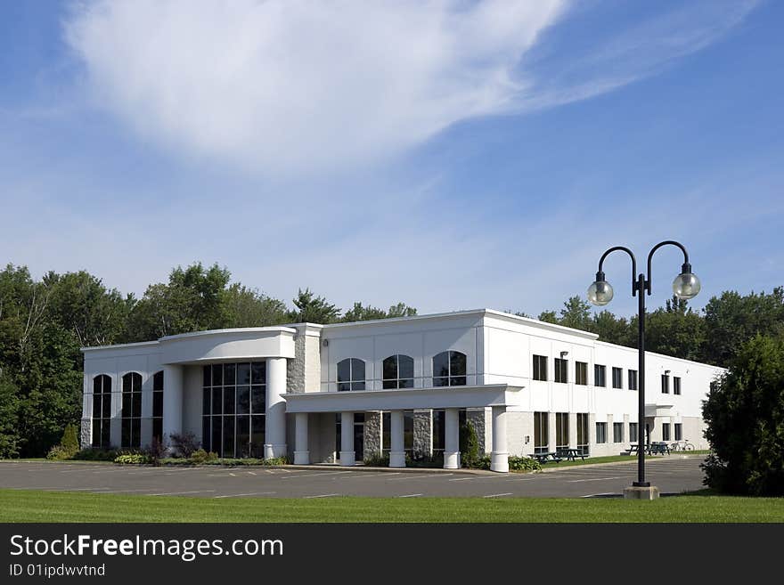 Modern office building with nature in background. Modern office building with nature in background