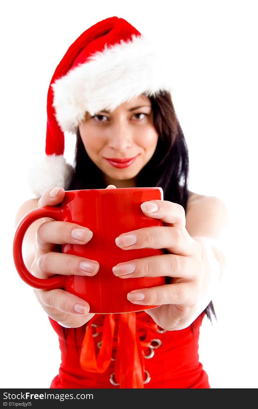 Attractive young female in christmas hat holding coffee mug with white background