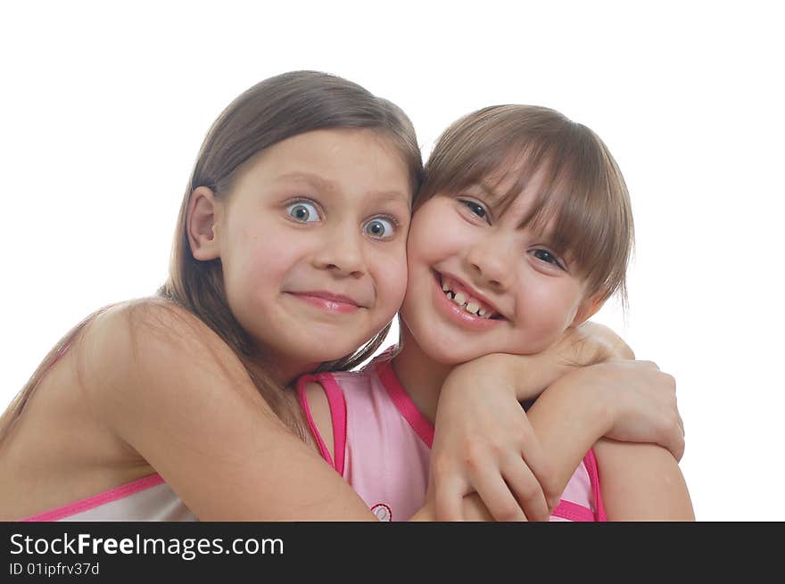 Two young girls isolated on the white background. Two young girls isolated on the white background