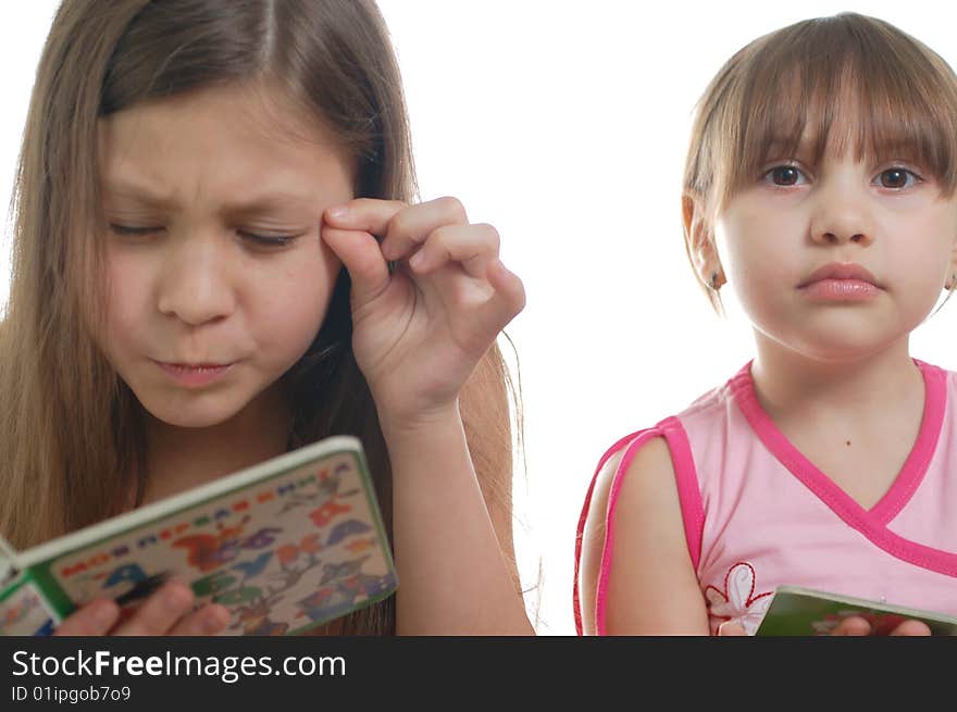 Two girls reading the book together