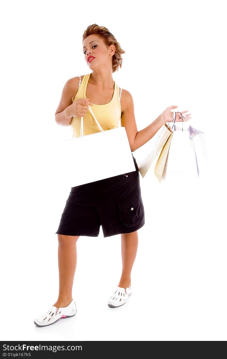 Standing model holding shopping bags