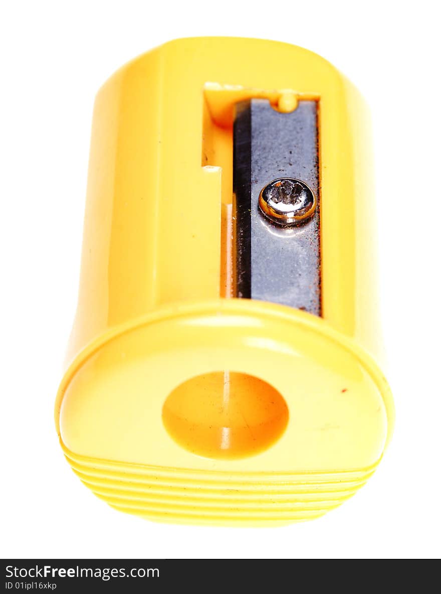 Plastic pencil sharpener. Yellow color. Isolated on the white background.