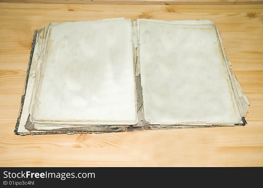 old book open on both blank pages and scratch