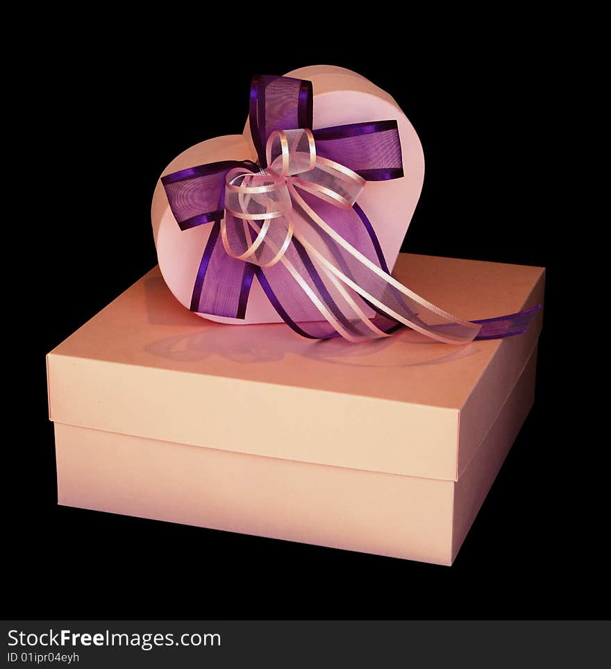 Gift boxes and ribbon isolated on black. Gift boxes and ribbon isolated on black.