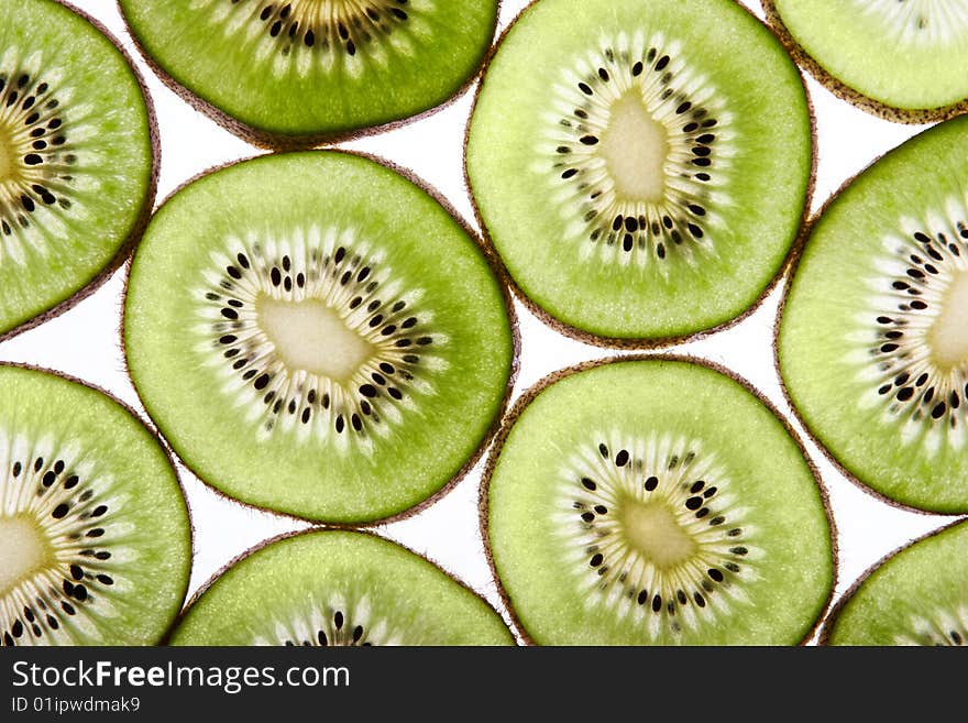 Fresh kiwi slices isolated on white background