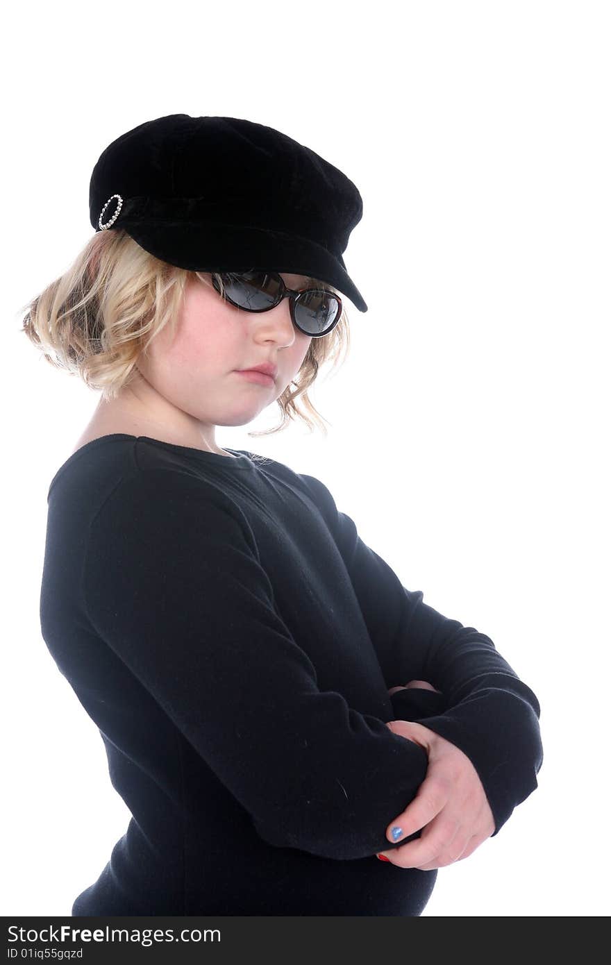 Cute girl in black hat, shirt, and sunglasses with arms crossed. Cute girl in black hat, shirt, and sunglasses with arms crossed