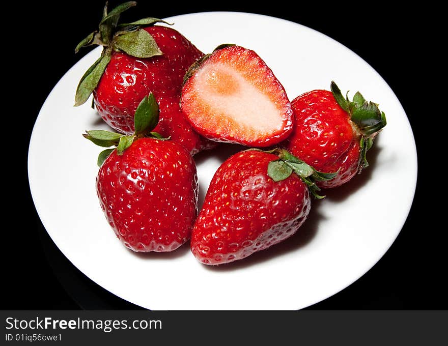 Ripe strawberry on a plate