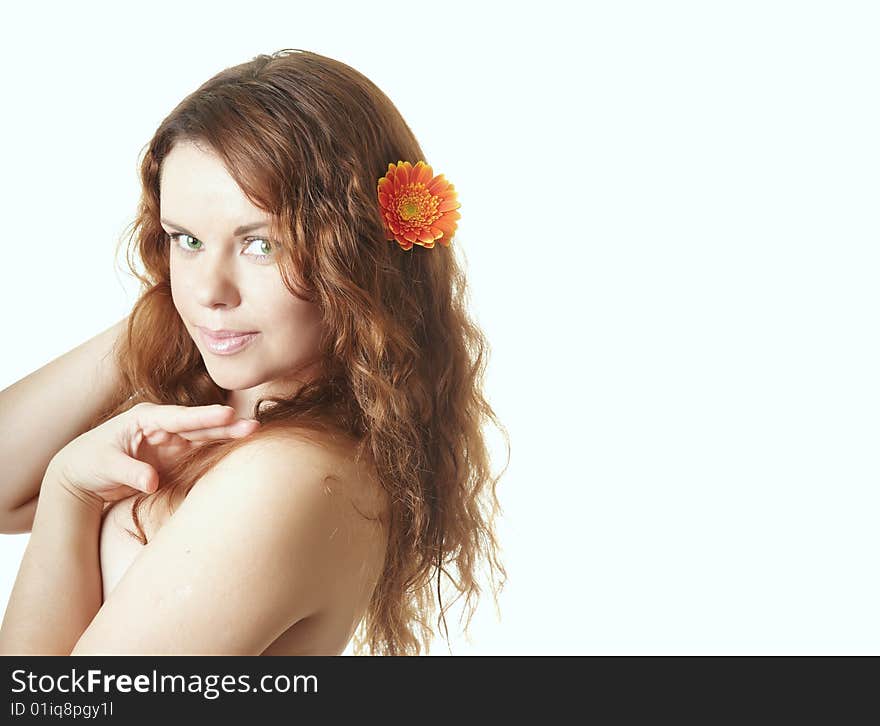 Beautiful woman with flower in a hair