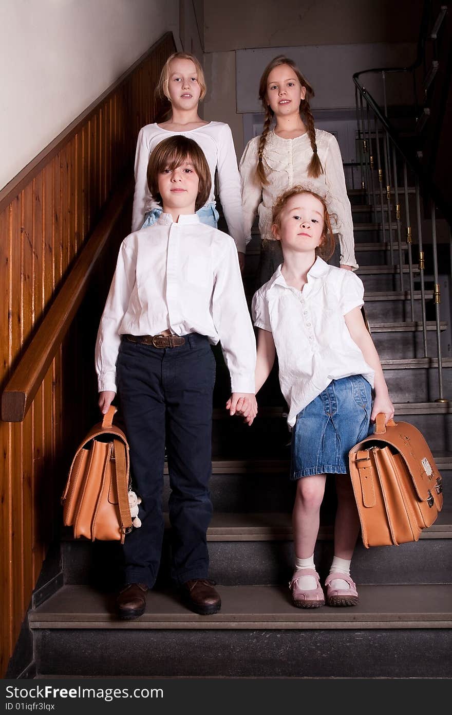 Group of little students with different ageson the stairs. Group of little students with different ageson the stairs