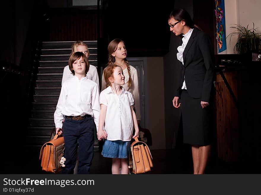 Group of little students with different ageson the stairs. Group of little students with different ageson the stairs