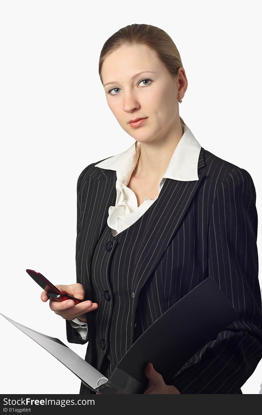 Young beautiful businesswoman with folder and cell