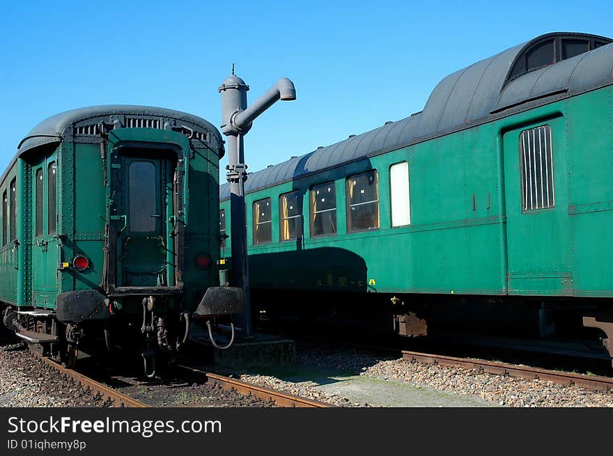 Two green historical travelcargos angainst a bleu-sky. Two green historical travelcargos angainst a bleu-sky