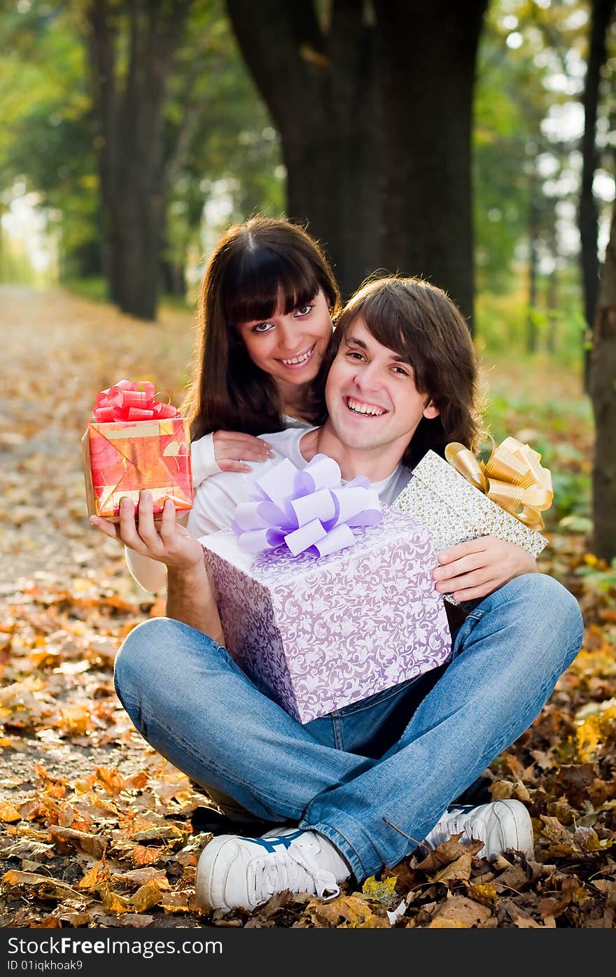 Young Couple With Gift Boxes