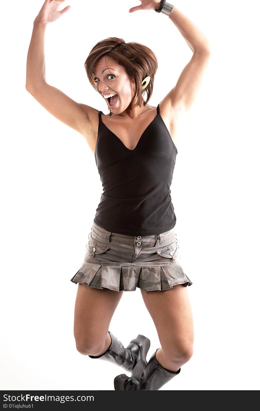 Woman jumping in the air with beautiful smile on a white background. Woman jumping in the air with beautiful smile on a white background