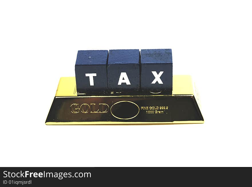 The word tax on top of a bar of gold