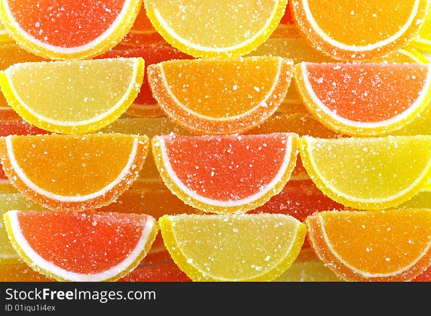 Four rows of colorful  fruit jellies. Four rows of colorful  fruit jellies