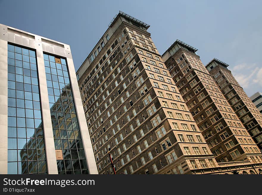 Highrises Battered by Hurricane Ike against blue sky