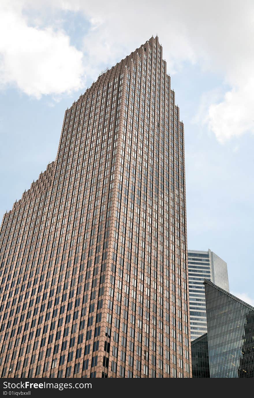 Great Towering Skyscrapers against cloudy sky