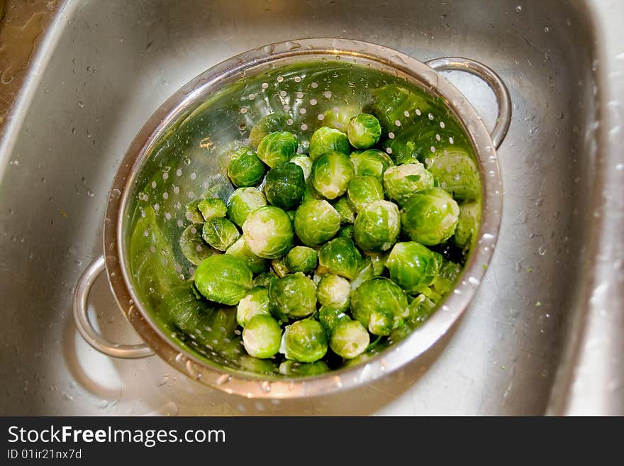 Brussel sprout in silver strainer