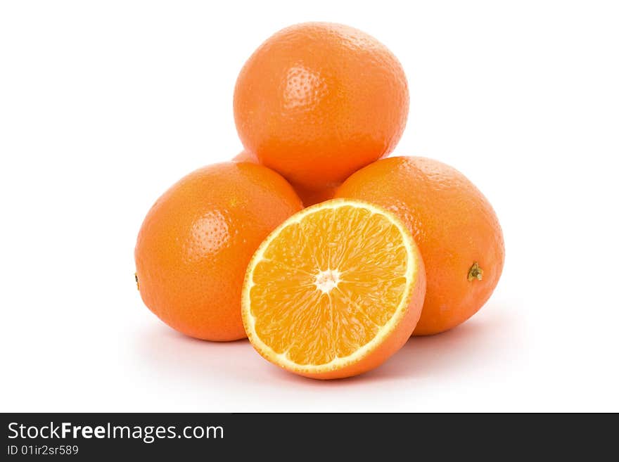 Many oranges are in a heap. Many oranges are in a heap