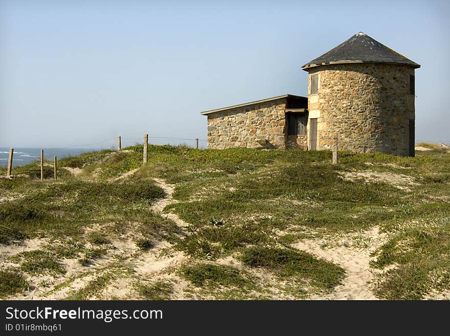 Old windmill on a sunny coast