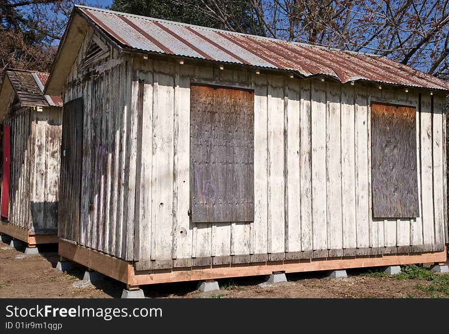 Rustic wooden cabins with metal roof