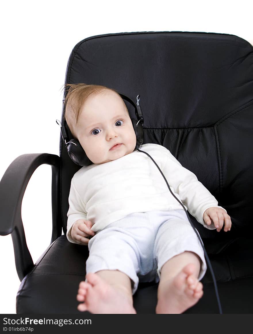 Baby with headphones on white