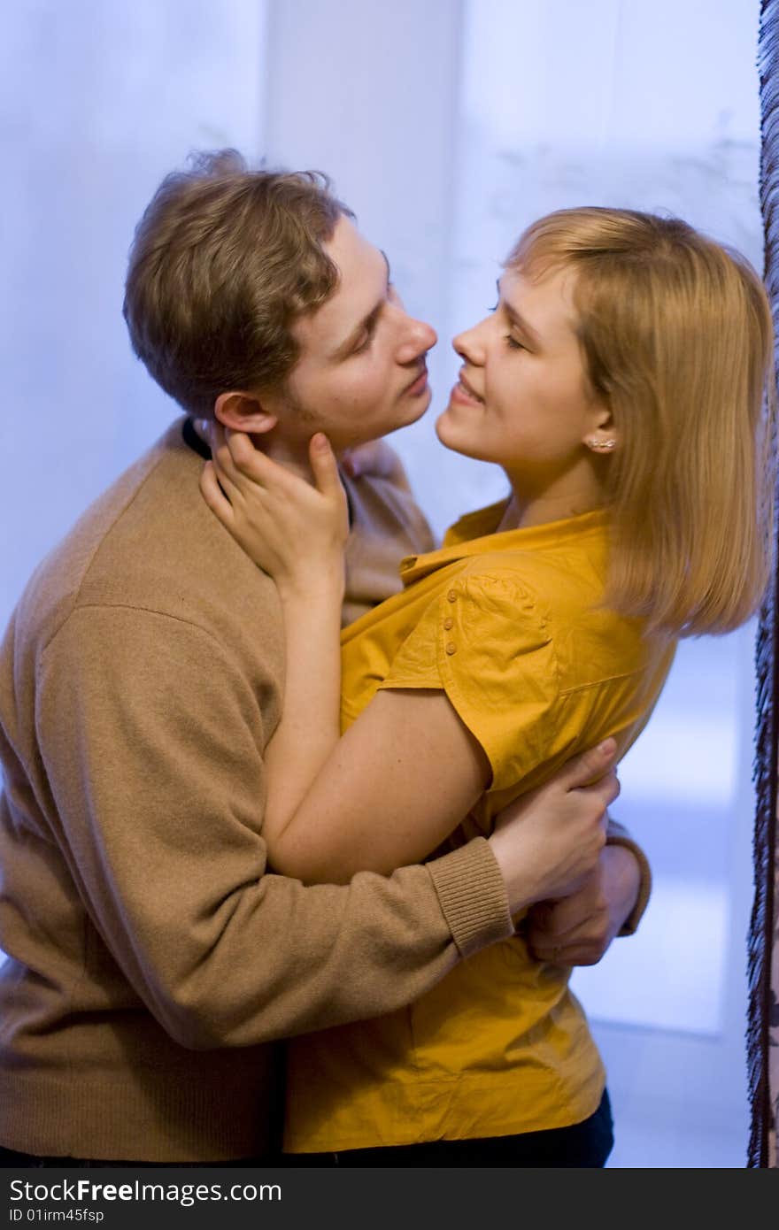 Happy young couple is happy. The girl and the young man are smiling. Happy young couple is happy. The girl and the young man are smiling.