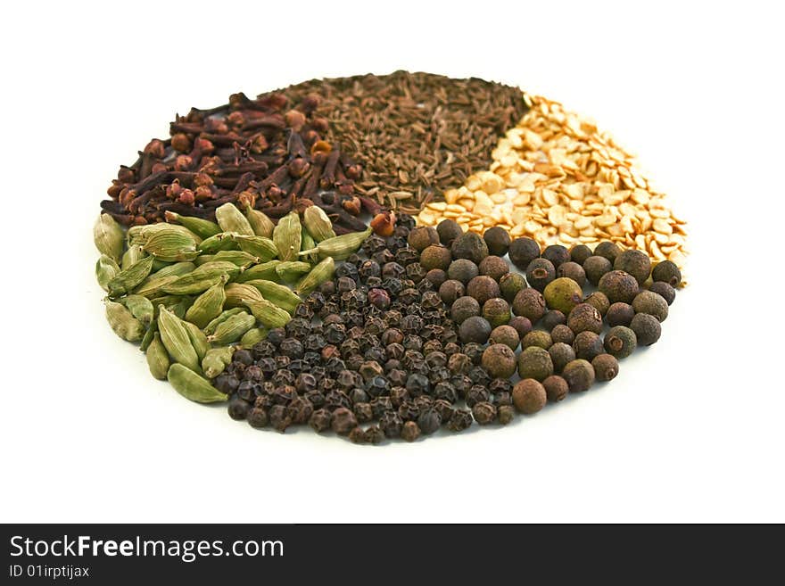 Cloves, black pepper, cardamom, cumin, white background. Cloves, black pepper, cardamom, cumin, white background