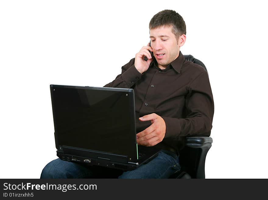 Businessman with laptop calling on by phone. Isolated