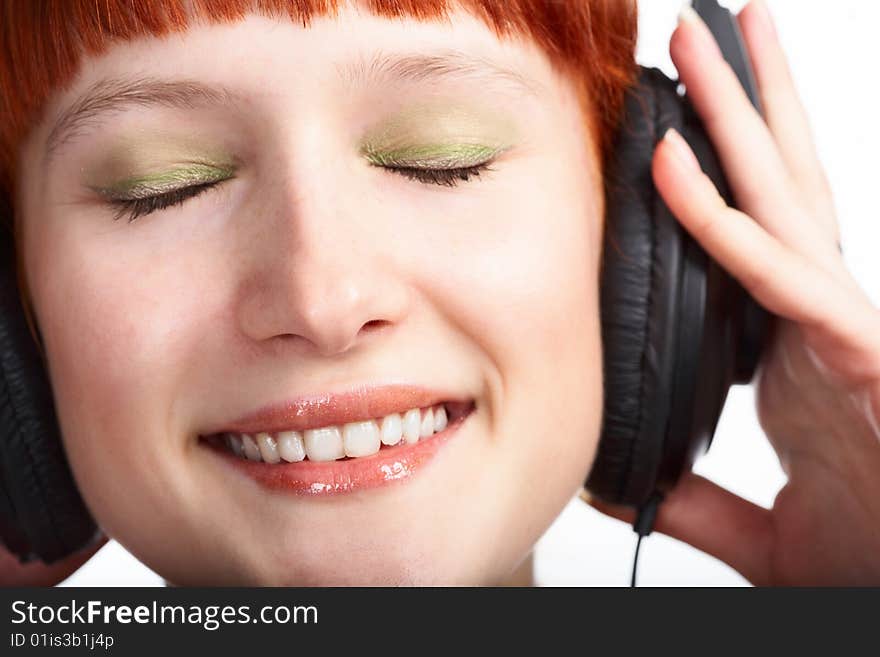 Beauty girl in head phones on white background