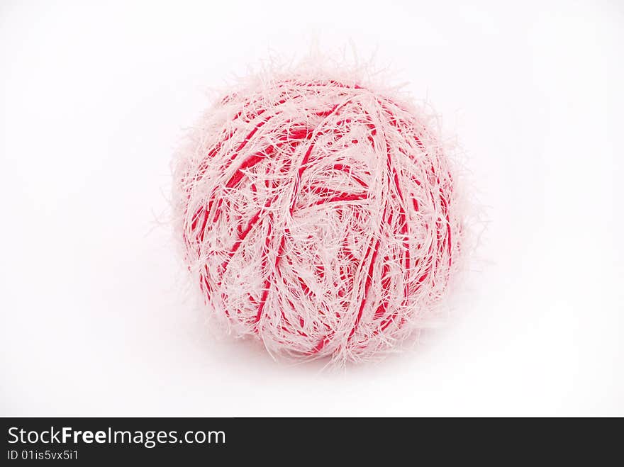 Red and white threads clew  isolated on a white background. Red and white threads clew  isolated on a white background