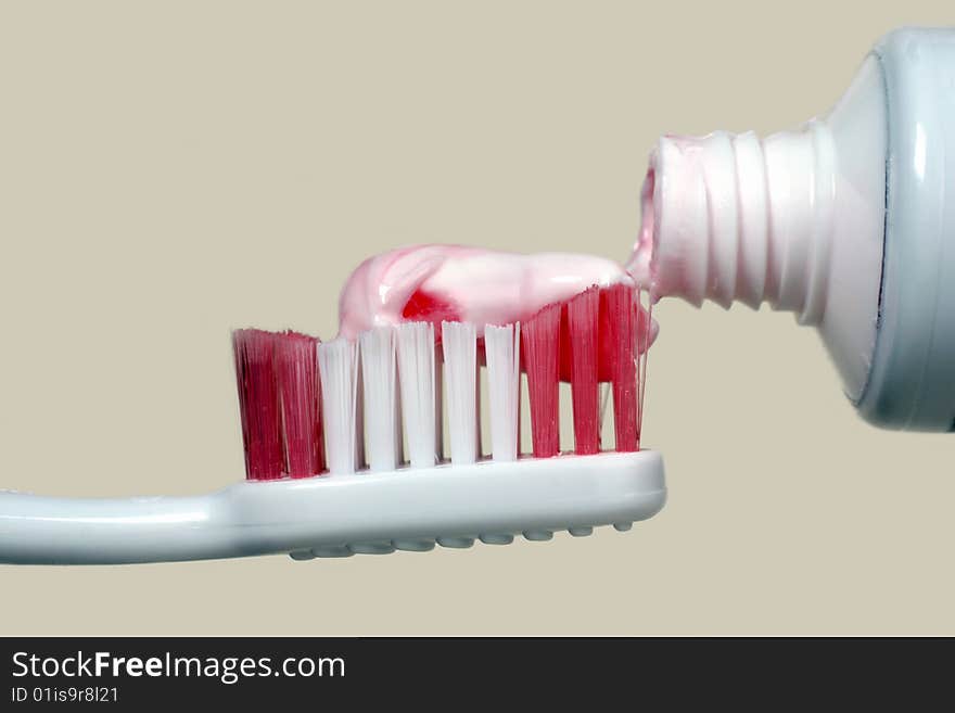 Tooth paste,toothbrush and tube on a light background