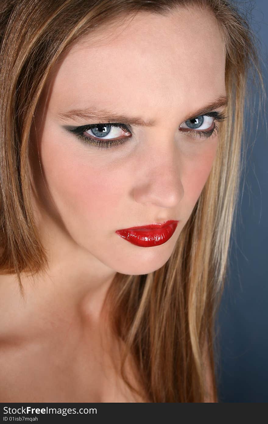 Beautiful young female model with dark make-up