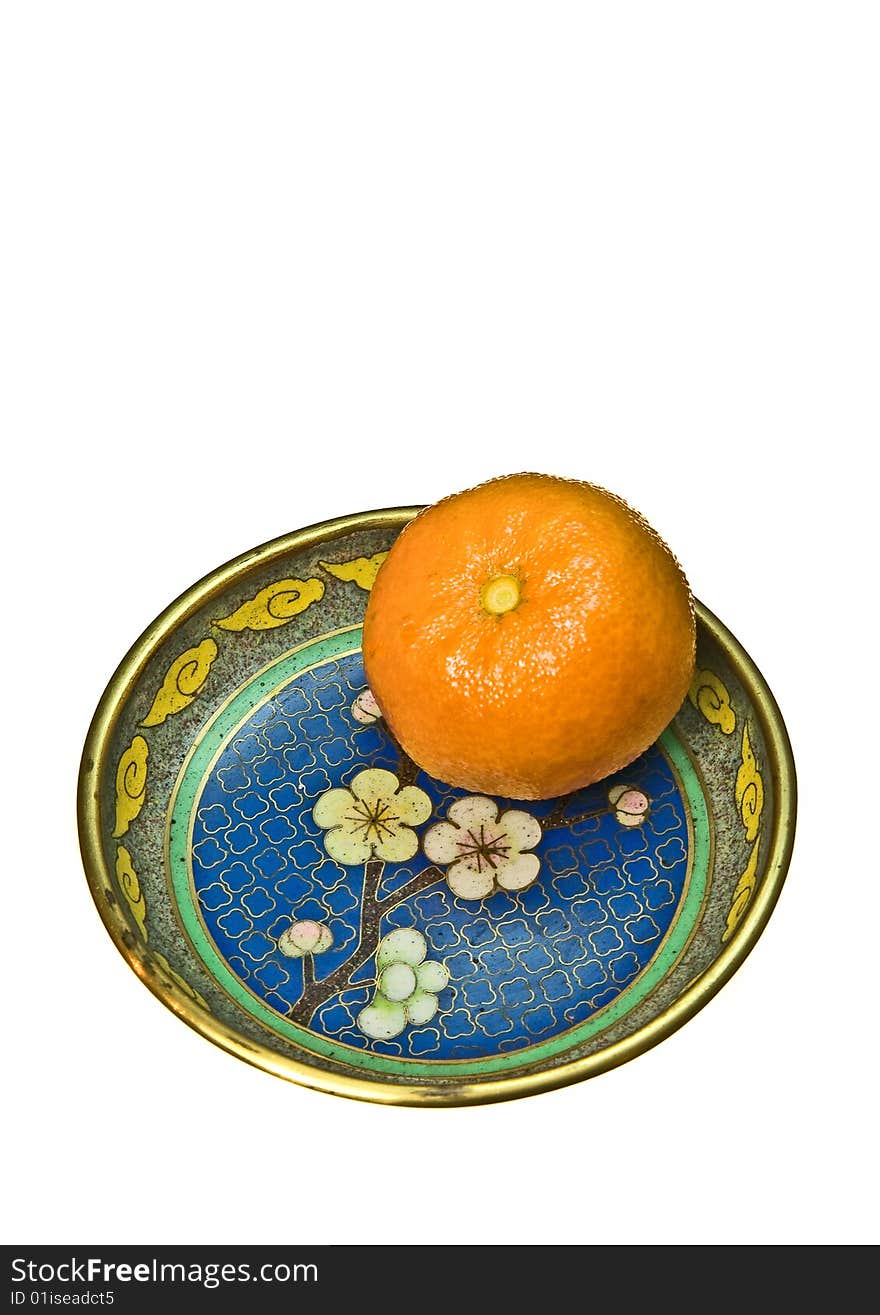 Tangerine on a plate, isolated