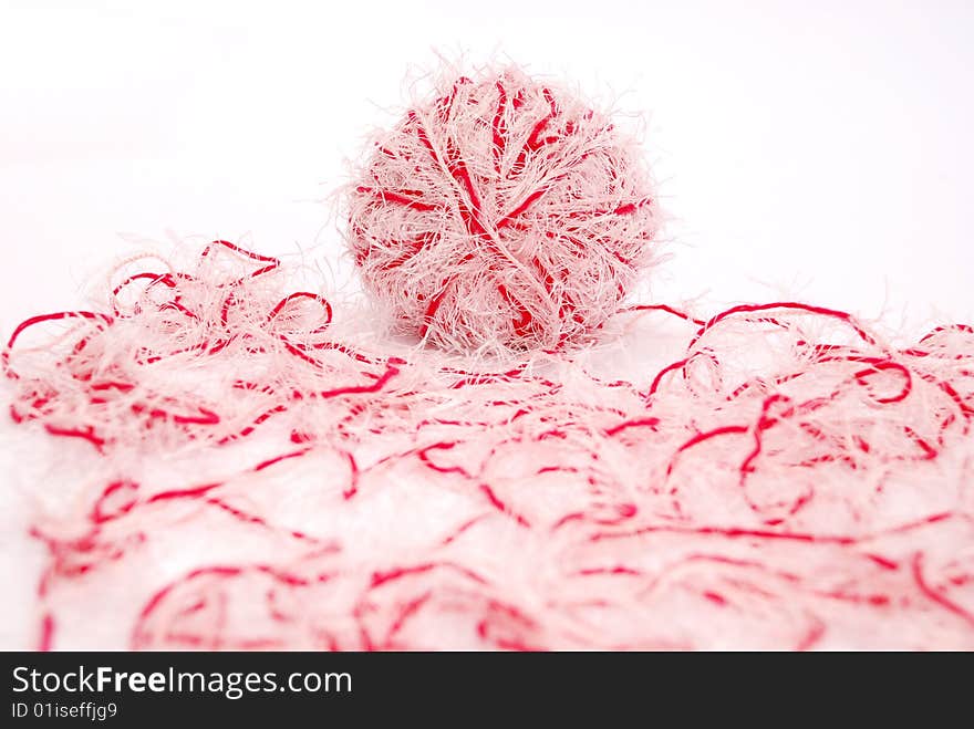 Red and white threads clew  isolated on a white background. Red and white threads clew  isolated on a white background