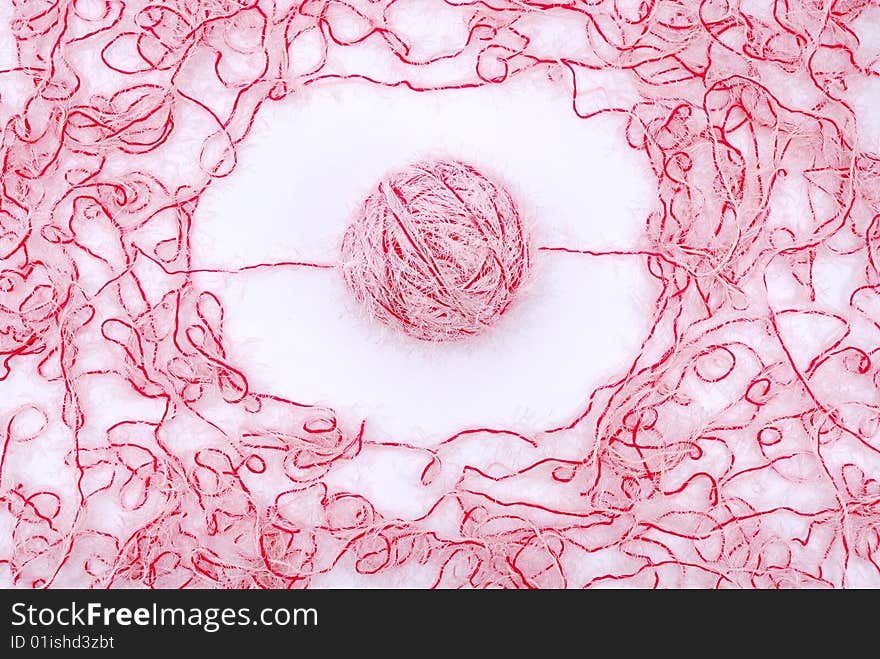 Red and white threads clew  isolated on a white background. Red and white threads clew  isolated on a white background