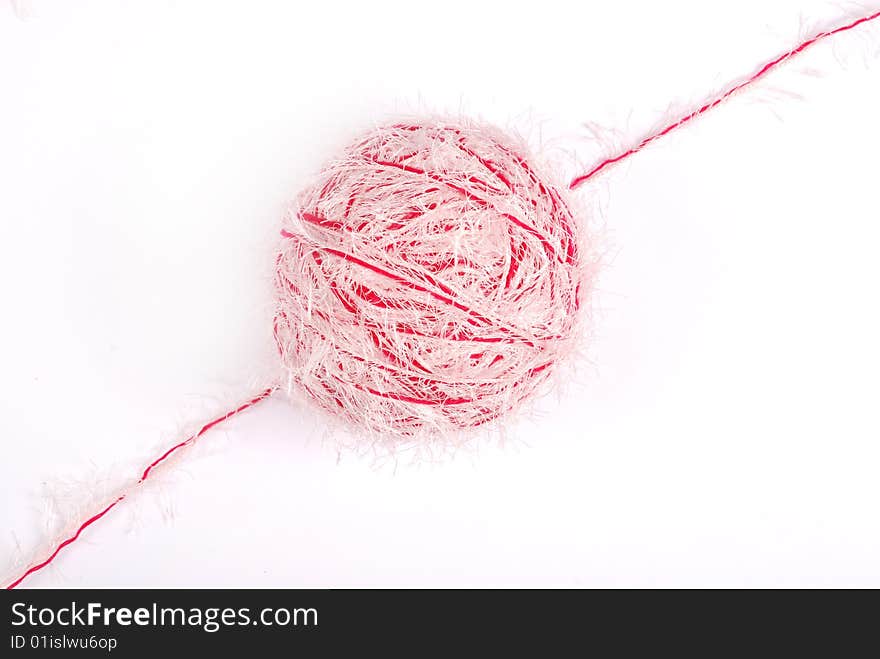 Red and white threads clew  isolated on a white background. Red and white threads clew  isolated on a white background