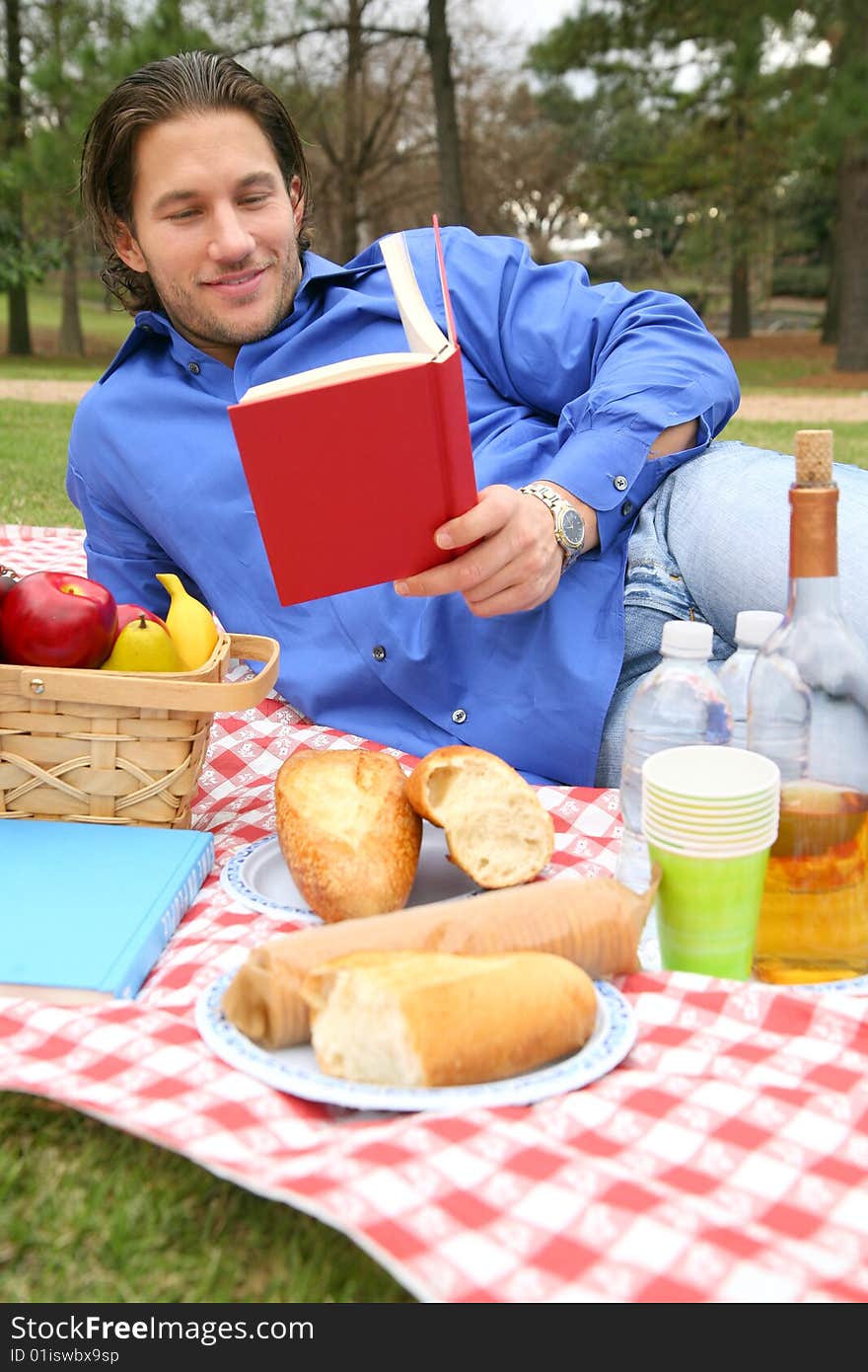 Young Caucasian Male Reading Book Outdoor